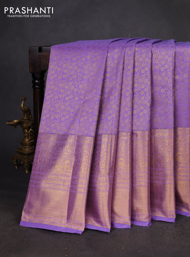 Kanchipuram silk saree lavender with allover zari woven brocade weaves and long zari woven border