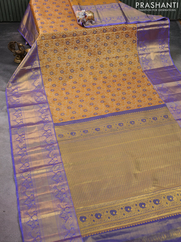 Kanchipuram tissue silk saree mustard yellow and lavender with allover zari woven brocade weaves and long zari woven border