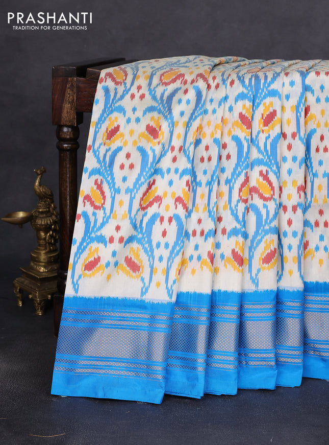 Pochampally silk saree off white and cs blue with allover ikat prints and zari woven border