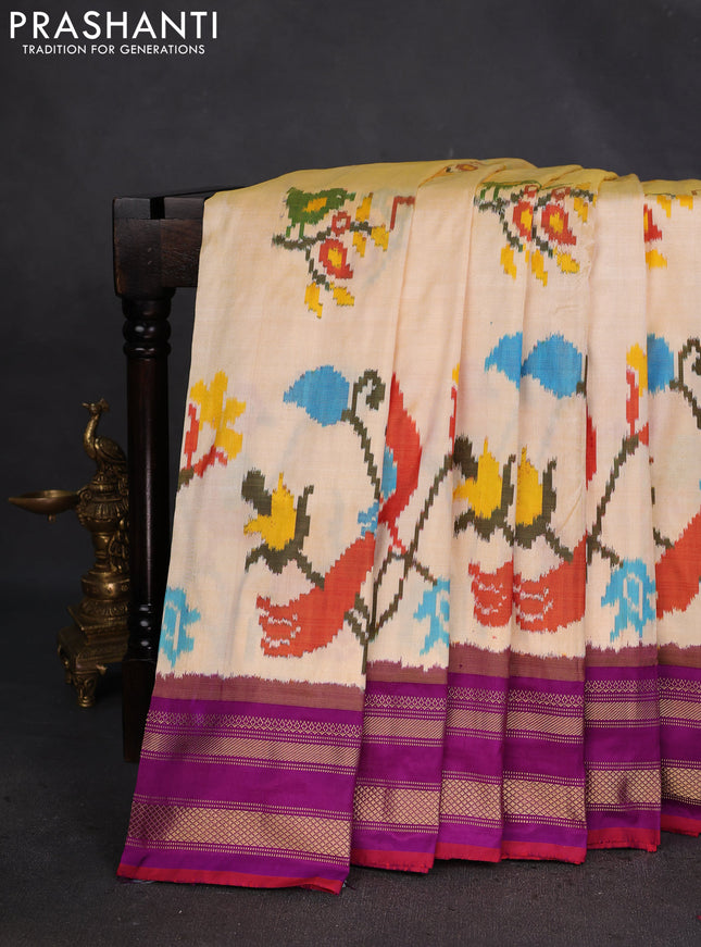 Pochampally silk saree pale yellow and purple with allover ikat weaves and rettapet zari woven border
