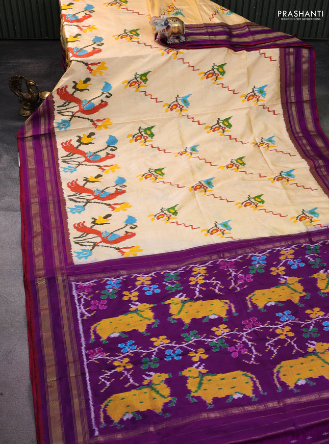 Pochampally silk saree pale yellow and purple with allover ikat weaves and rettapet zari woven border