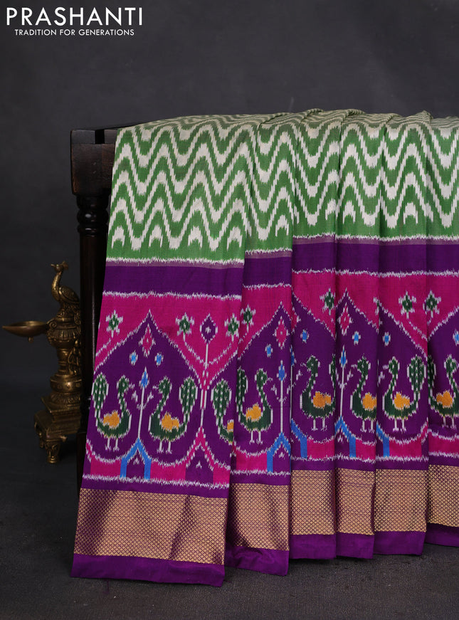 Pochampally silk saree green and purple with allover zig zag ikat weaves and long ikat woven zari border