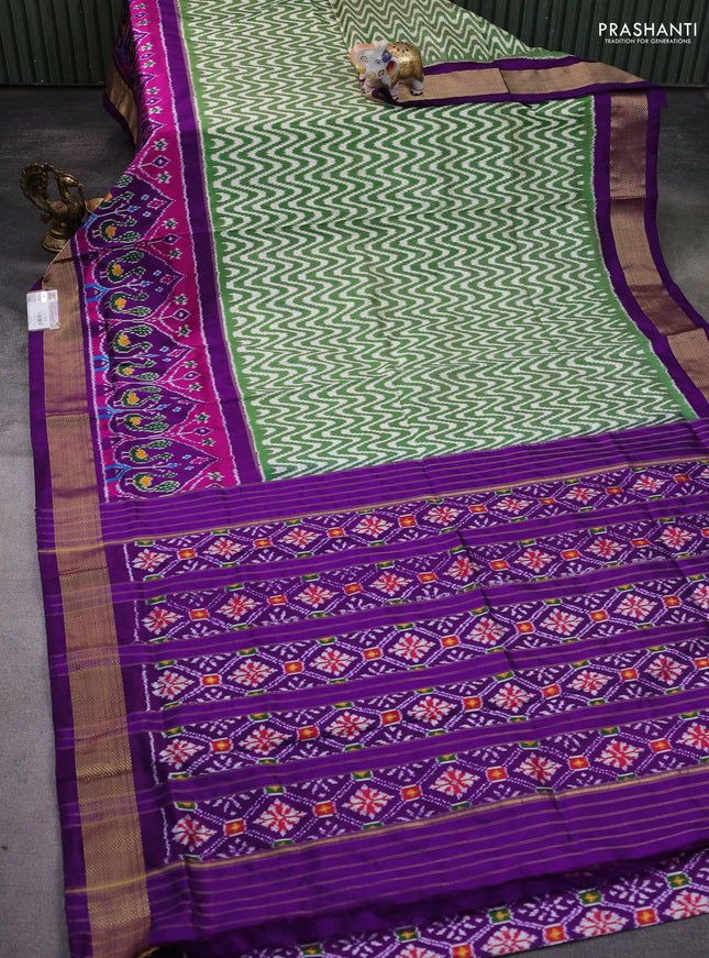 Pochampally silk saree green and purple with allover zig zag ikat weaves and long ikat woven zari border