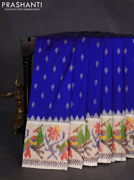 Pochampally silk saree blue and cream with allover ikat buttas and temple design zari woven ikat border