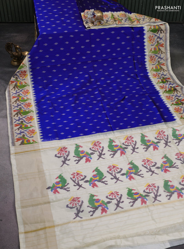 Pochampally silk saree blue and cream with allover ikat buttas and temple design zari woven ikat border