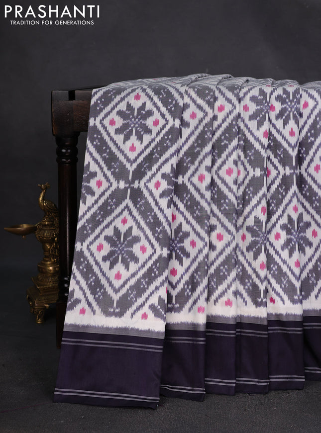 Pochampally silk saree off white and deep navy blue with allover ikat weaves and rettapet border