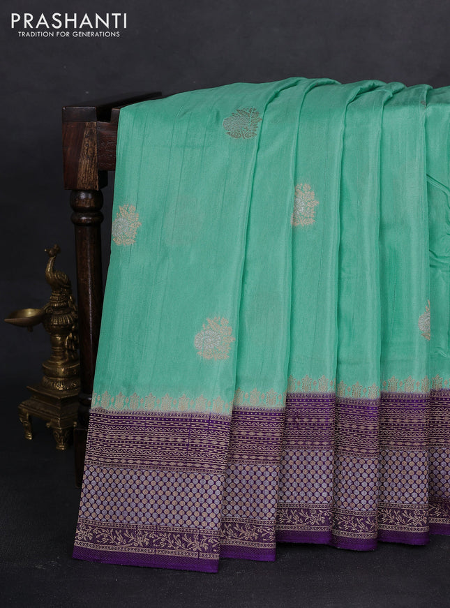 Semi raw silk saree teal green and violet with silver & gold flower zari woven buttas and zari woven border