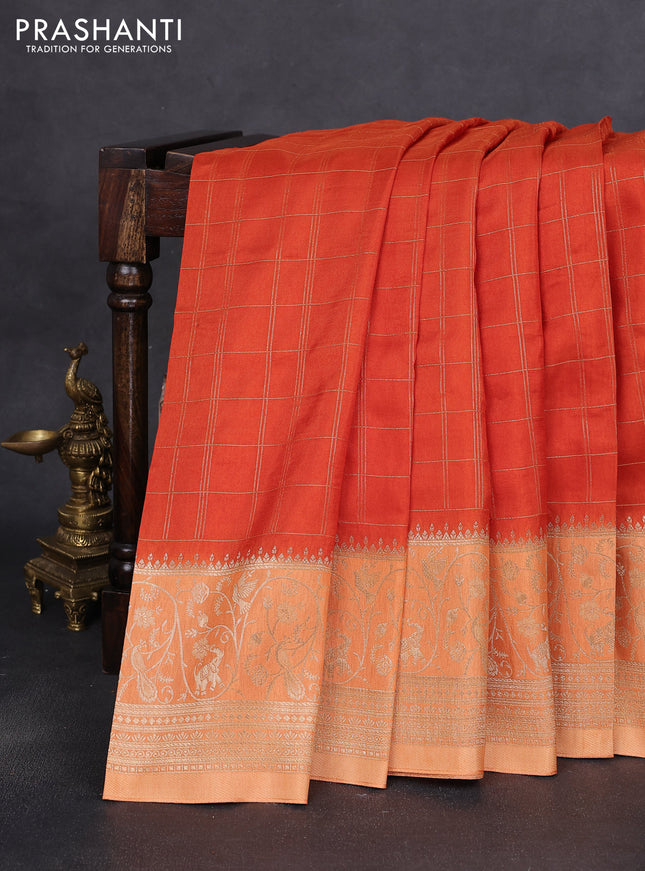 Semi raw silk saree orange and pale orange with allover zari woven checked pattern and zari woven border
