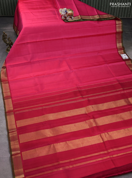 Pure kanchipuram silk saree pink and dual shade of green with plain body and rich zari woven border