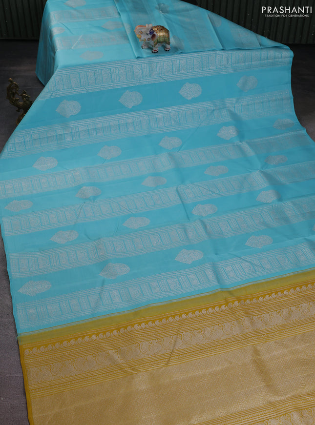 Pure kanchipuram silk saree teal blue and mustard yellow with allover silver zari weaves & buttas in borderless style