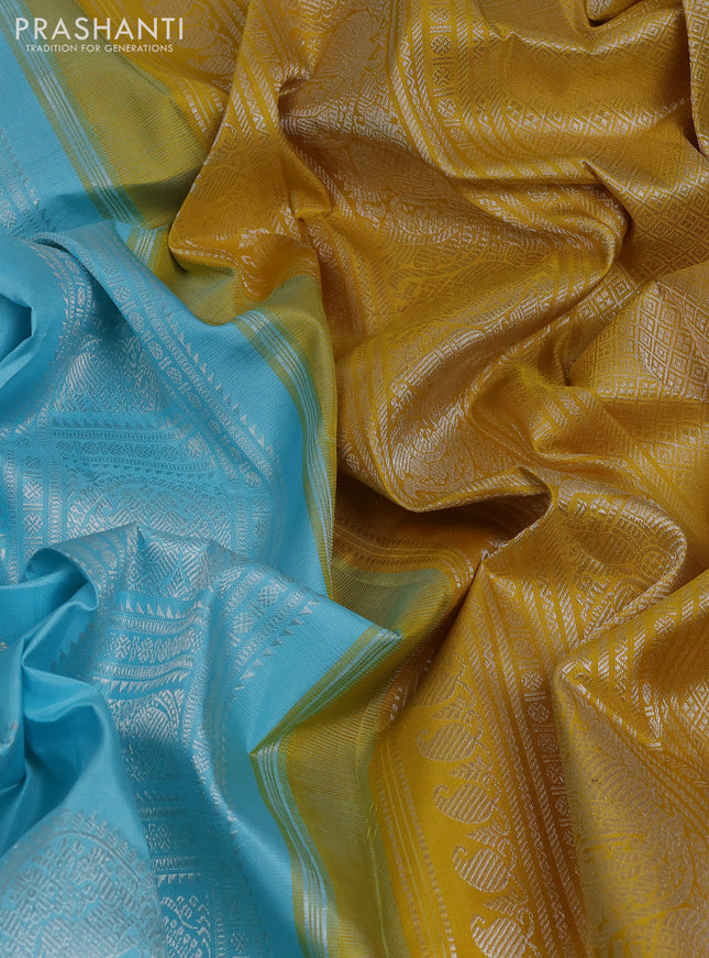 Pure kanchipuram silk saree teal blue and mustard yellow with allover silver zari weaves & buttas in borderless style