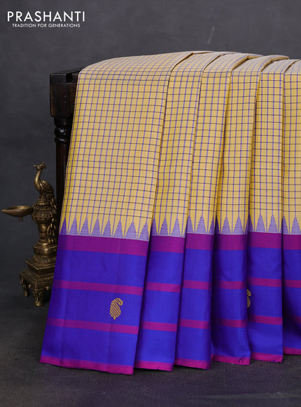 Pure kanchipuram silk saree pale yellow and blue with allover small checked pattern and temple design thread woven butta border