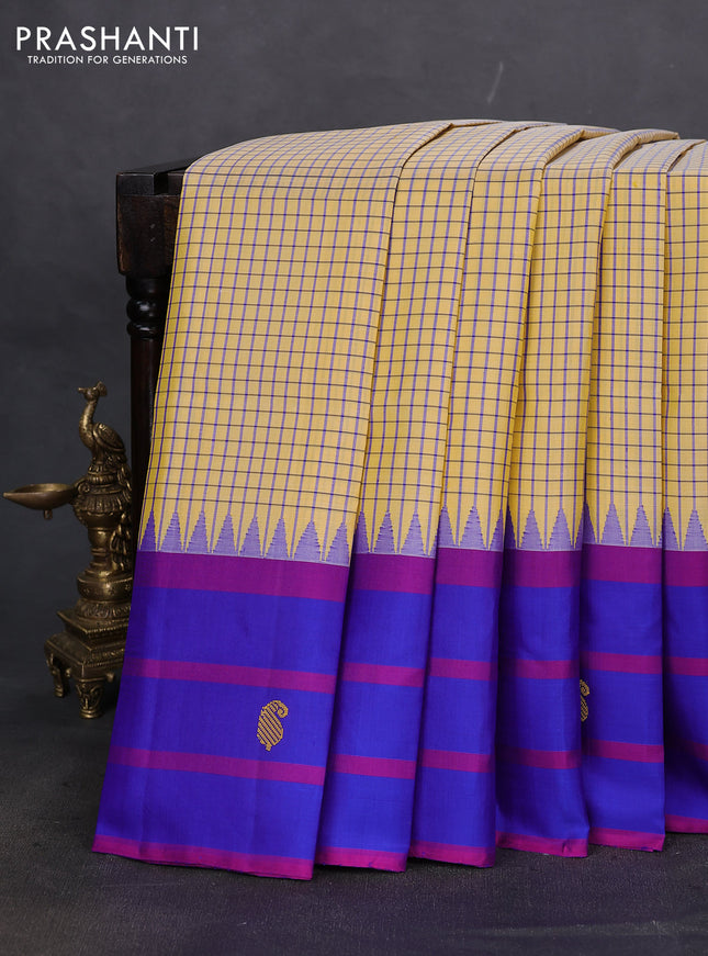 Pure kanchipuram silk saree pale yellow and blue with allover small checked pattern and temple design thread woven butta border