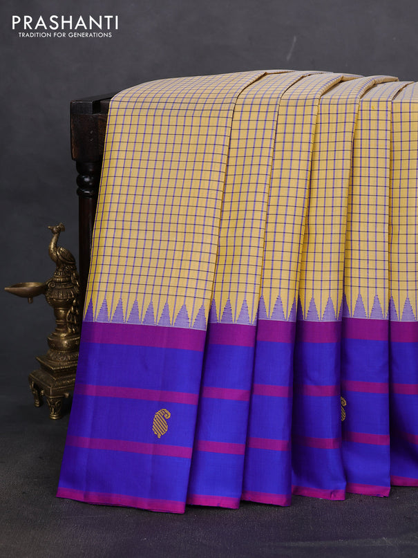 Pure kanchipuram silk saree pale yellow and blue with allover small checked pattern and temple design thread woven butta border