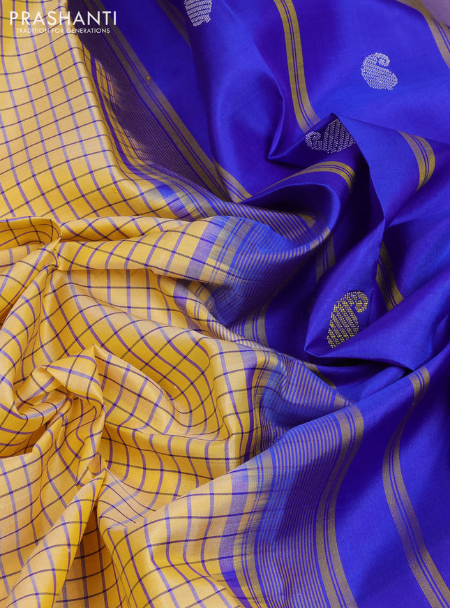 Pure kanchipuram silk saree pale yellow and blue with allover small checked pattern and temple design thread woven butta border