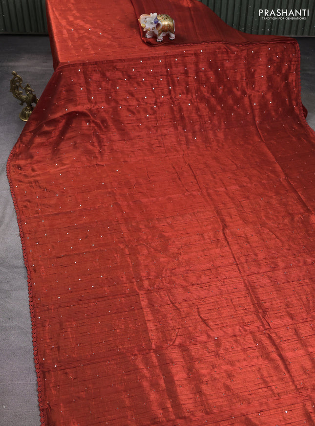 Semi raw silk saree rust shade with allover mirror work and lace work border