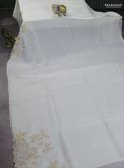 Satin Organza saree off white with plain body and floral design cut work border