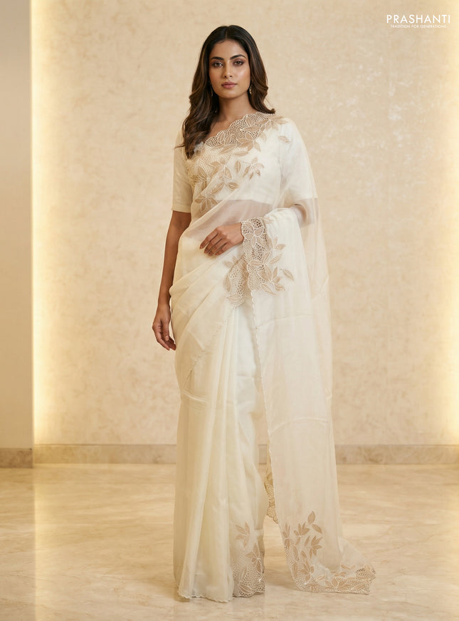 Satin Organza saree off white with plain body and floral design cut work border