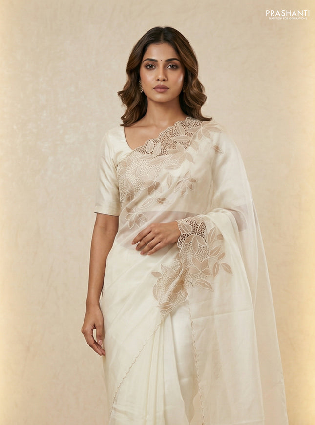 Satin Organza saree off white with plain body and floral design cut work border