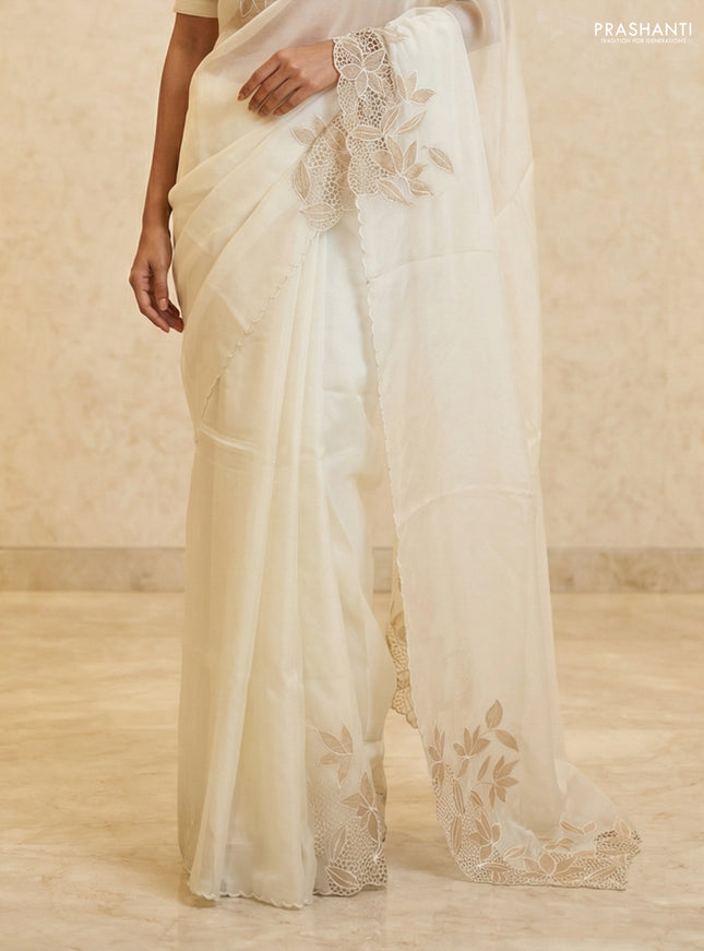 Satin Organza saree off white with plain body and floral design cut work border