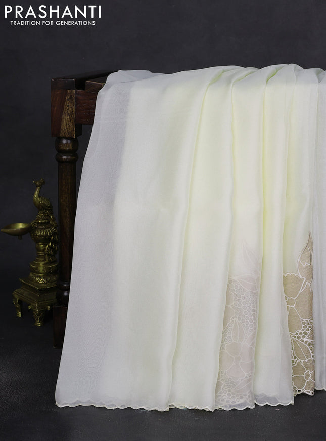 Satin Organza saree off white with plain body and floral design cut work border