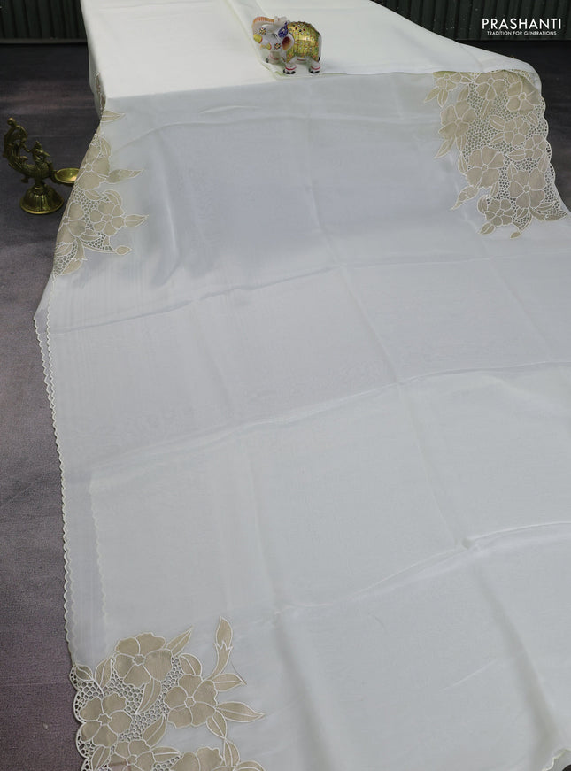Satin Organza saree off white with plain body and floral design cut work border