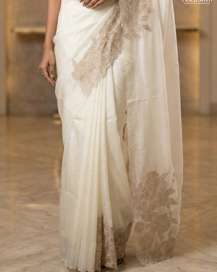 Satin Organza saree off white with plain body and floral design cut work border