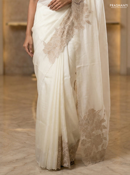 Satin Organza saree off white with plain body and floral design cut work border