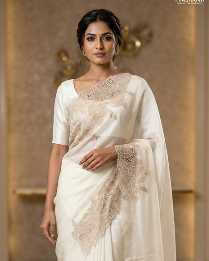Satin Organza saree off white with plain body and floral design cut work border