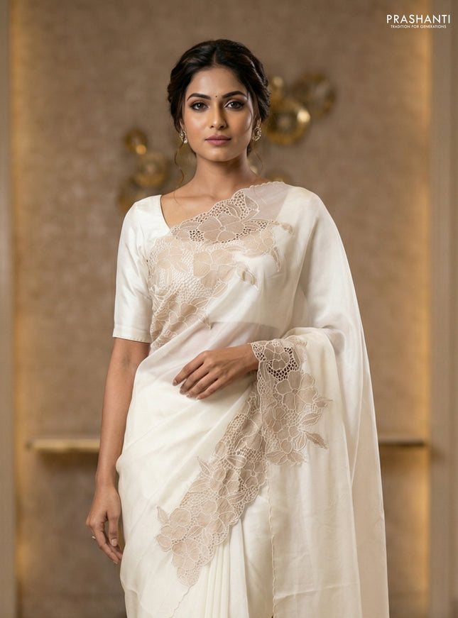 Satin Organza saree off white with plain body and floral design cut work border