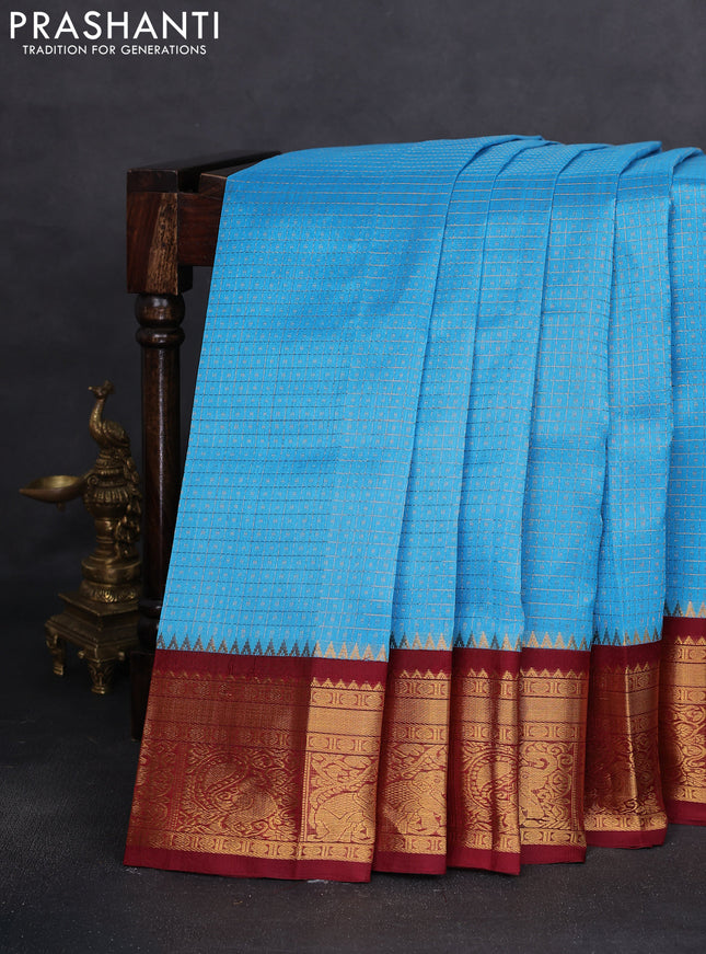Kuppadam silk cotton saree cs blue and maroon with allover lakshadeepam weaves and temple design zari woven border