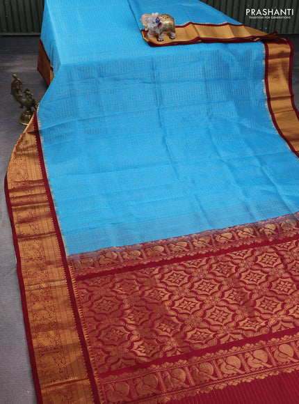 Kuppadam silk cotton saree cs blue and maroon with allover lakshadeepam weaves and temple design zari woven border