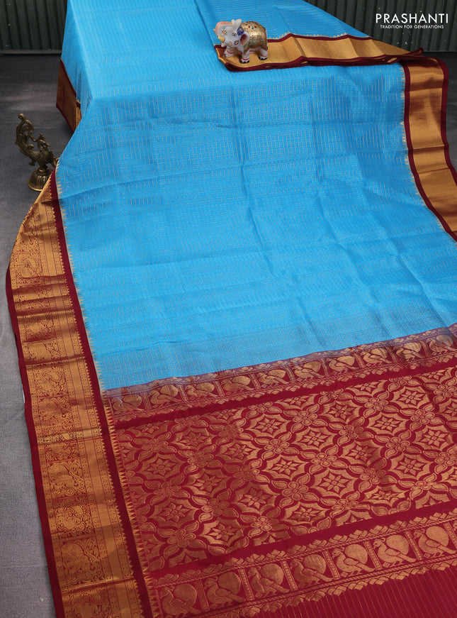 Kuppadam silk cotton saree cs blue and maroon with allover lakshadeepam weaves and temple design zari woven border