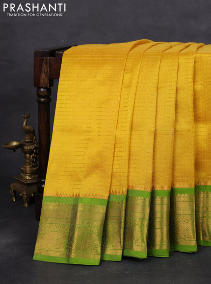 Kuppadam silk cotton saree yellow and green with allover lakshadeepam weaves and temple design zari woven border