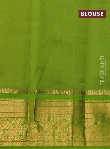 Kuppadam silk cotton saree yellow and green with allover lakshadeepam weaves and temple design zari woven border