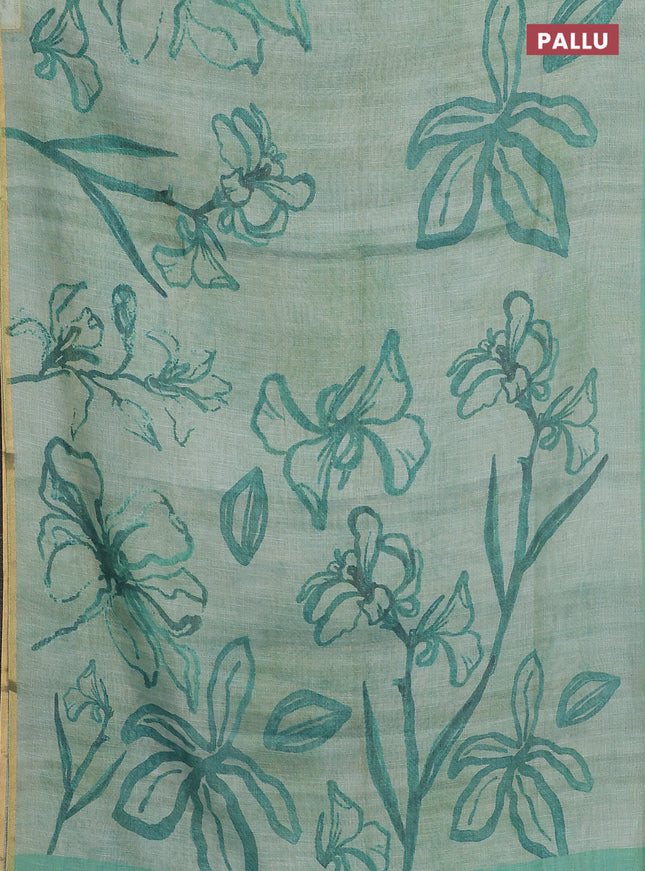 Linen cotton saree teal green with allover prints and zari woven piping border