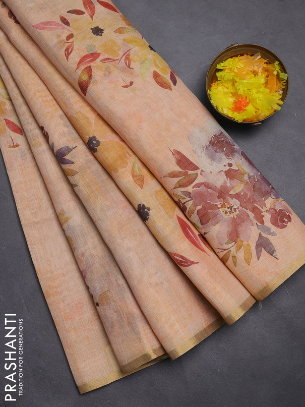 Linen cotton saree pale orange with floral digital prints and zari woven piping border