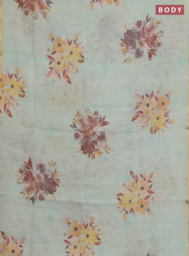 Linen cotton saree pastel green with floral digital prints and zari woven piping border