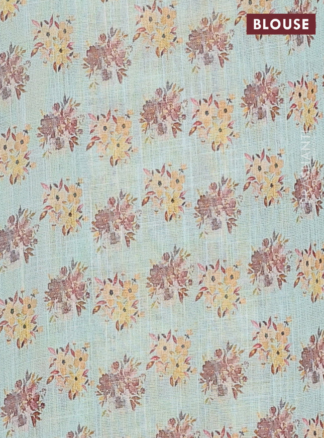 Linen cotton saree pastel green with floral digital prints and zari woven piping border