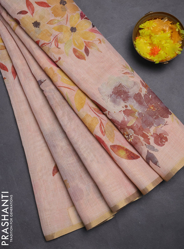 Linen cotton saree peach shade with floral digital prints and zari woven piping border