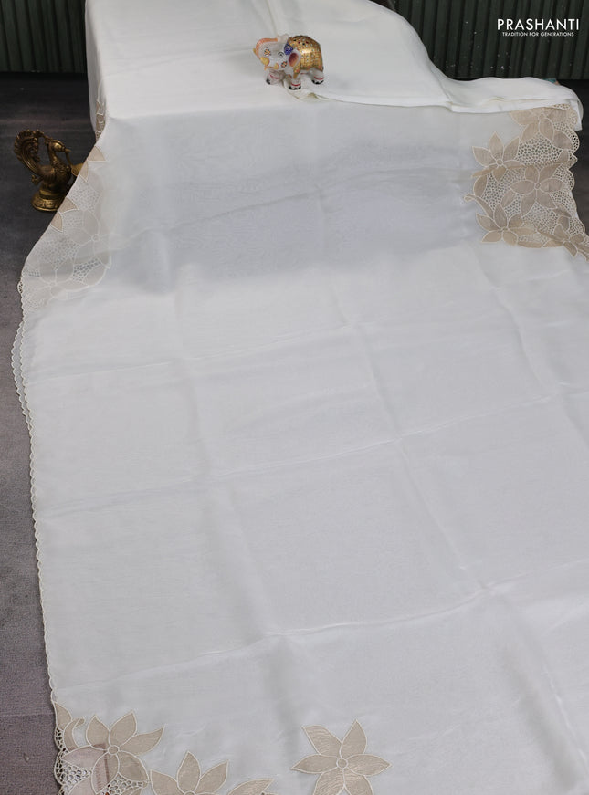 Satin Organza saree off white with plain body and floral design cut work border