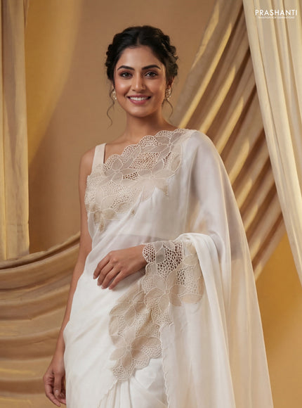 Satin Organza saree off white with plain body and floral design cut work border