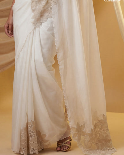 Satin Organza saree off white with plain body and floral design cut work border