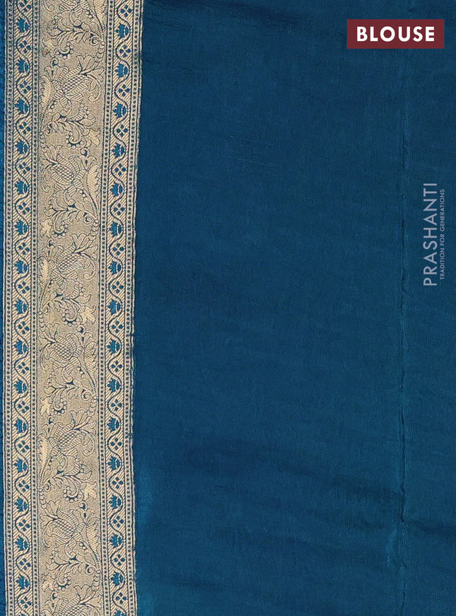 Crepe silk saree peaccock blue with allover mina weaves & sequin work and zari woven border
