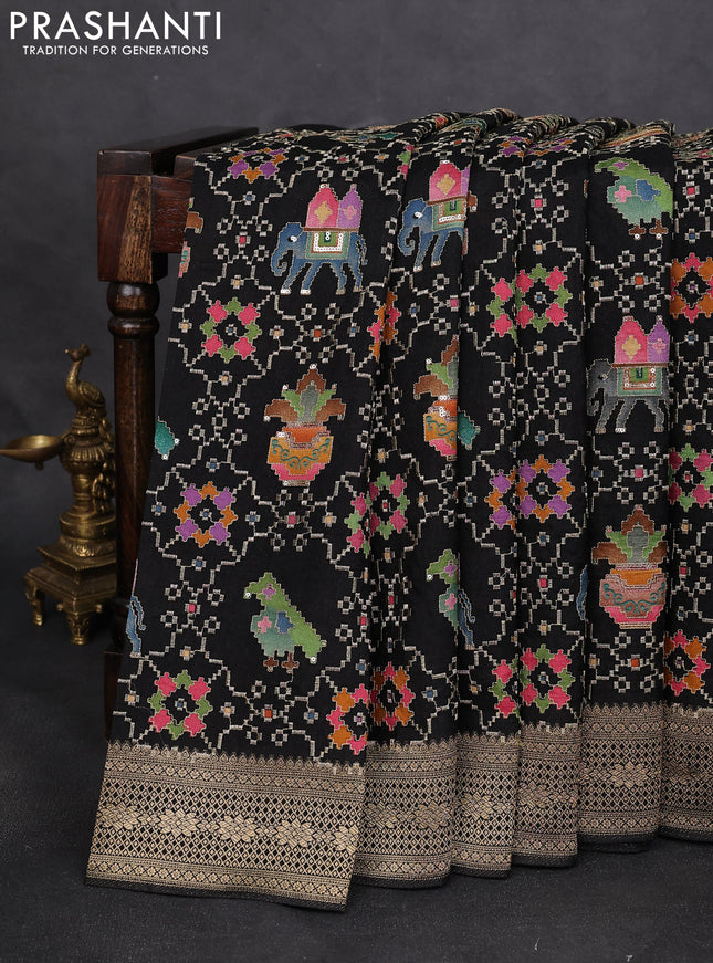 Crepe silk saree black with allover patola mina weaves & sequin work and zari woven border