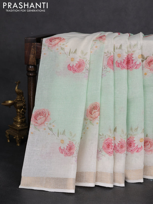 Pure linen saree teal green and cream with allover flower prints and zari woven border
