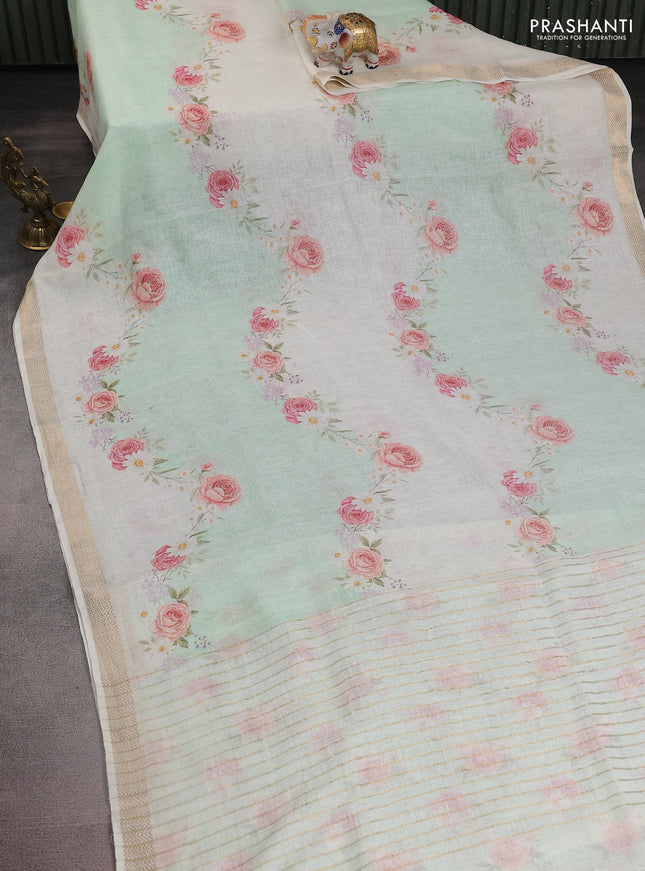 Pure linen saree teal green and cream with allover flower prints and zari woven border