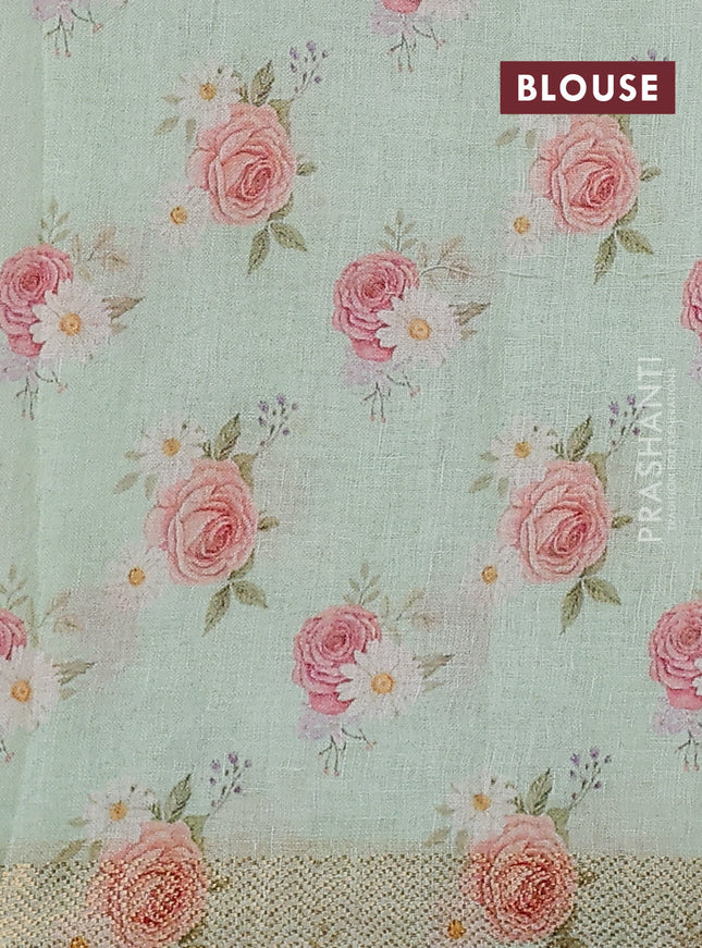 Pure linen saree teal green and cream with allover flower prints and zari woven border