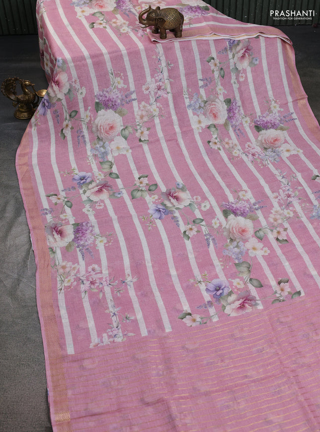 Pure linen saree peach pink and off white with allover flower prints and zari woven border