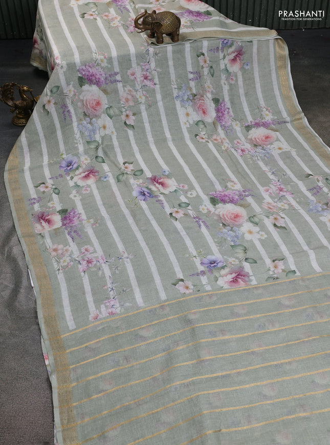Pure linen saree pista green and off white with allover flower prints and zari woven border